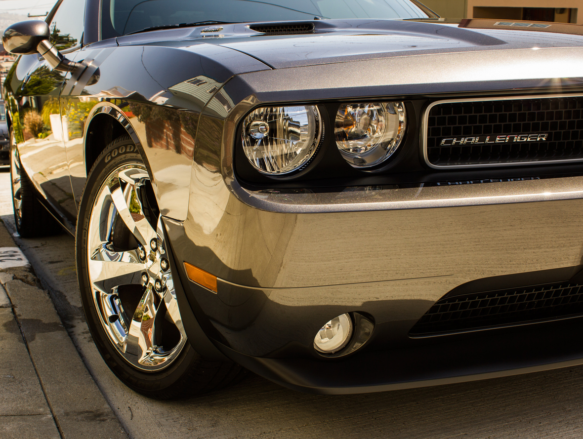 Close up front angle view of a late model Dodge Challenger muscle car.
