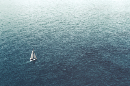 Lone sailboat on the ocean representing trying to navigate without a map. KPIs. Credit: https://www.istockphoto.com/portfolio/francescoch