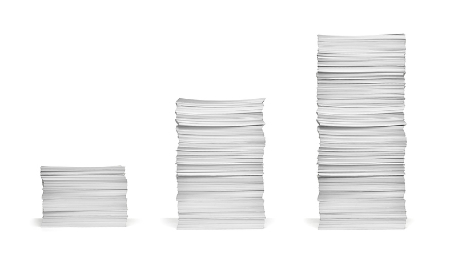 Increasingly taller stacks of paper. Credit: https://www.istockphoto.com/portfolio/paperkites