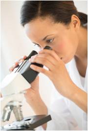 doctor looking through a microscope
